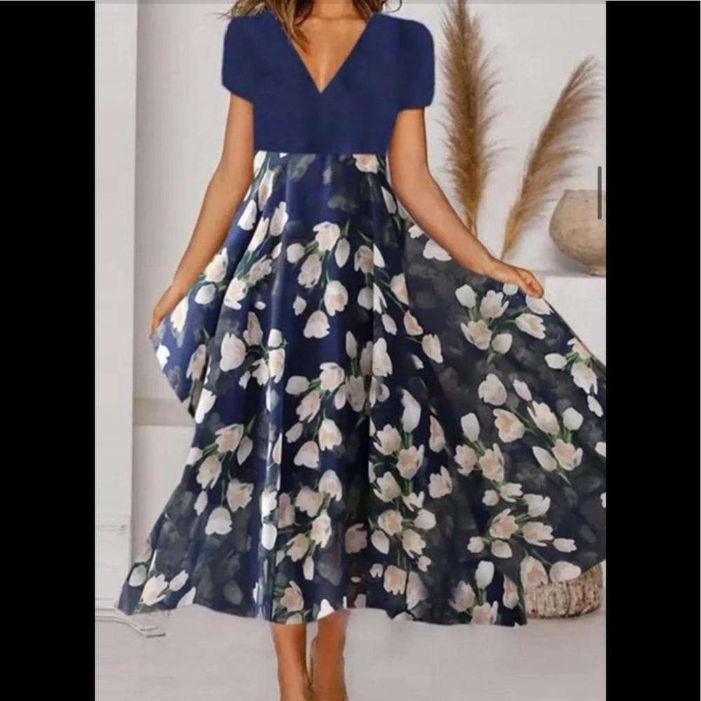 Tee length blue dress with floral pattern